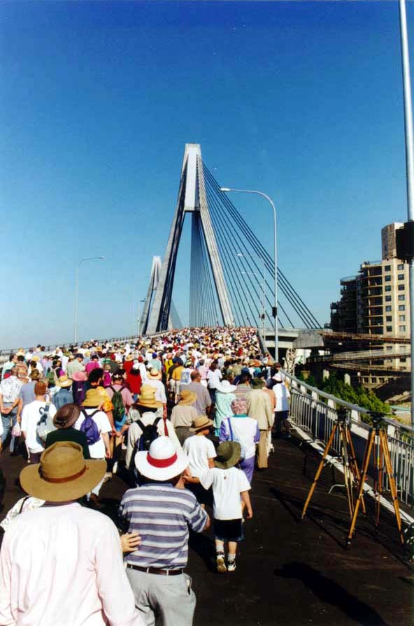 Crowds heading west across the bridge